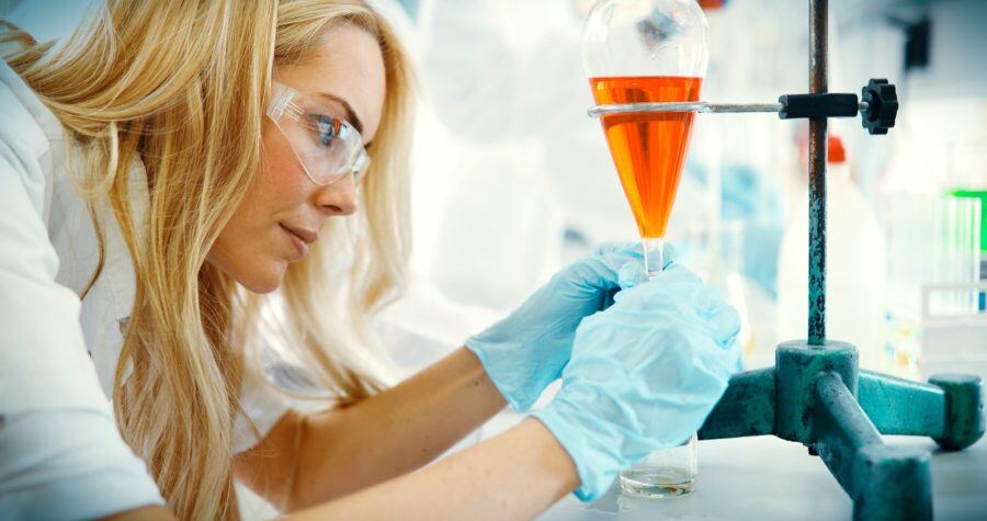 attractive-student-of-chemistry-working-in-laboratory