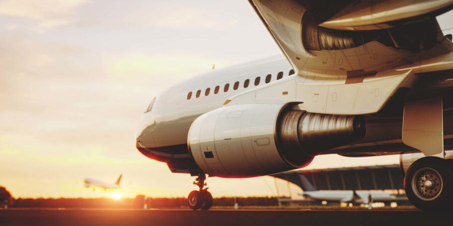 white-commercial-airplane-QAK4PSR-scaled